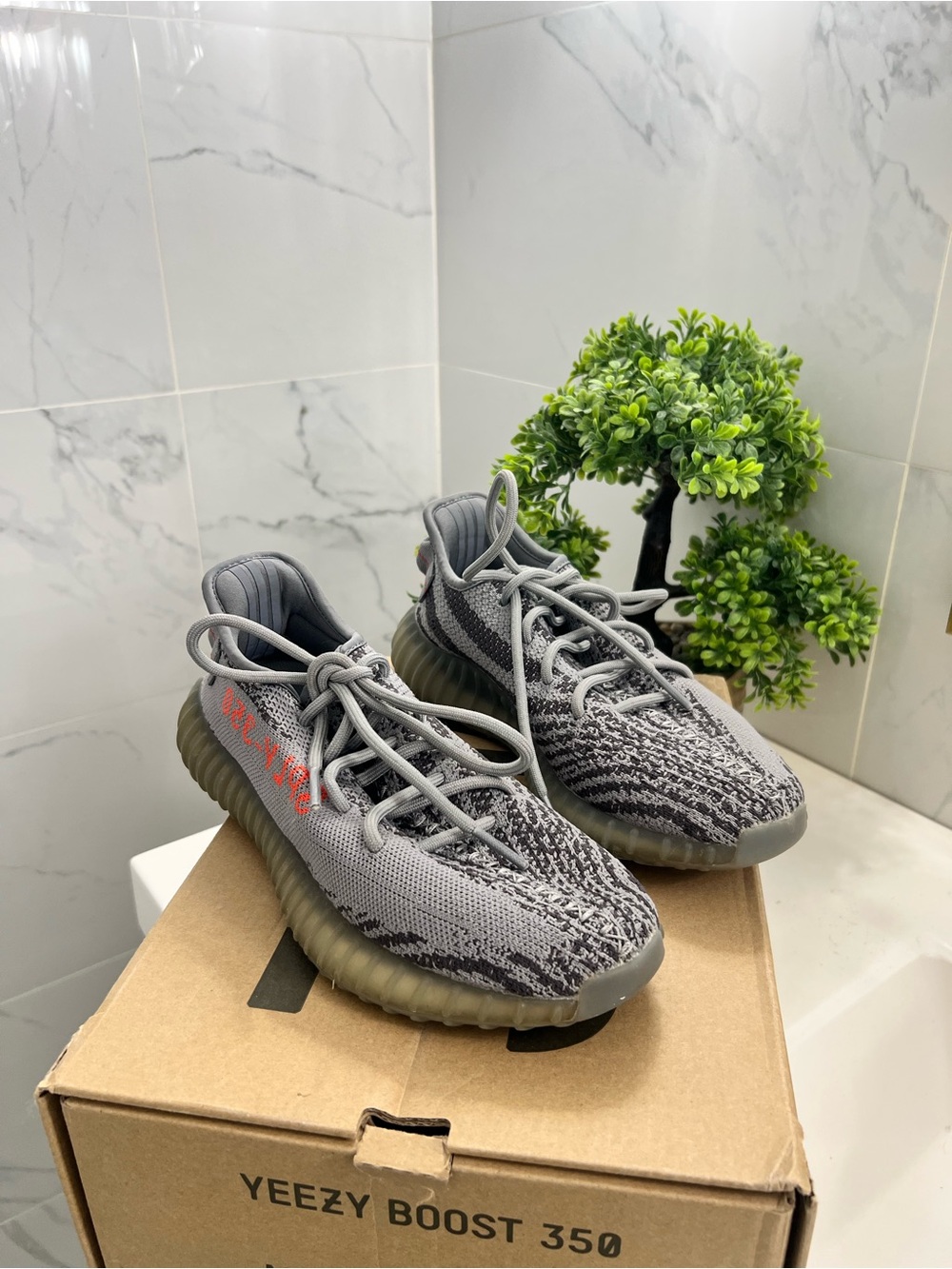 Yeezy women’s  Grey Knit Sneakers with Red Accent